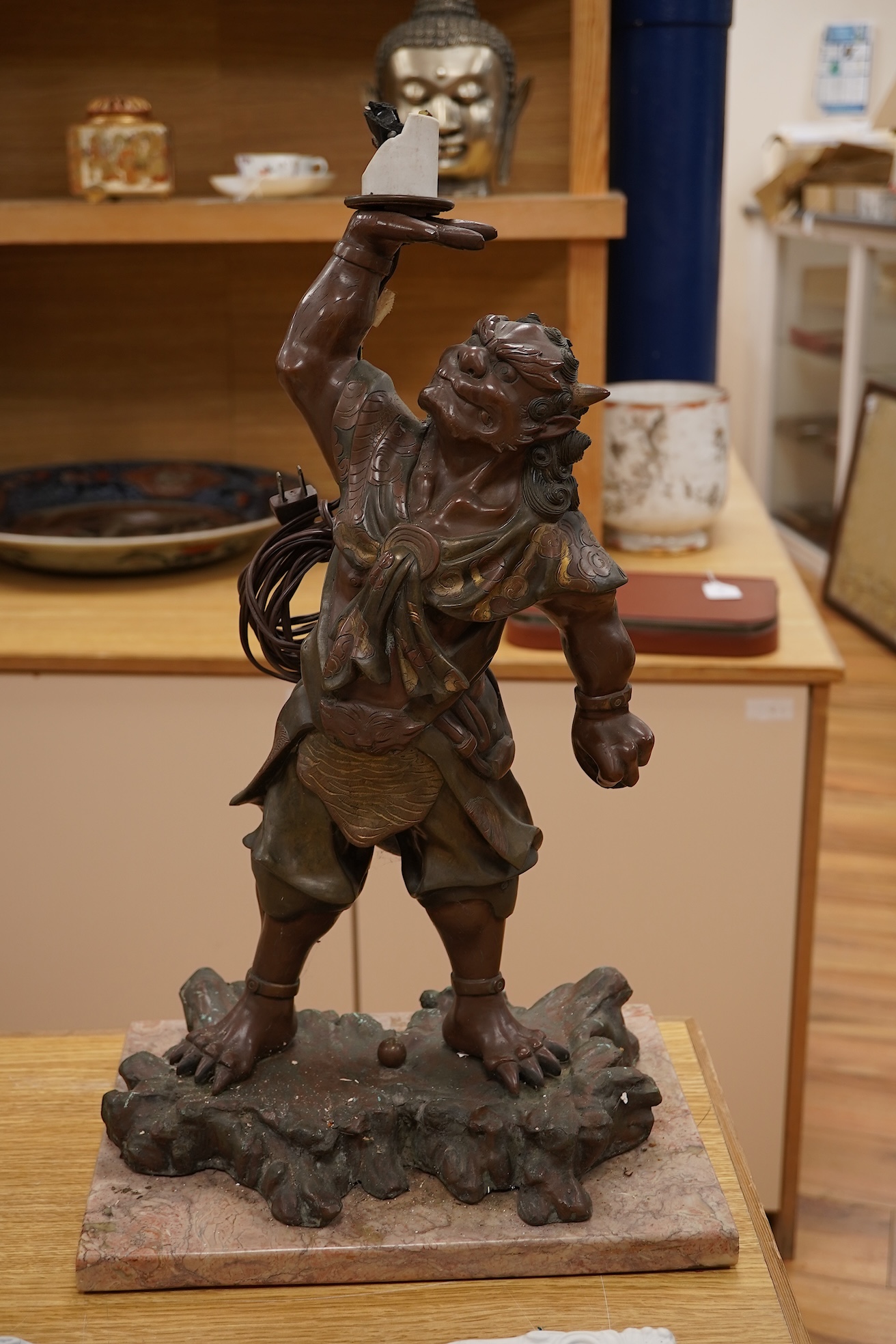 A Japanese bronze model of an oni, Meiji period, now mounted as a lamp, 50cm